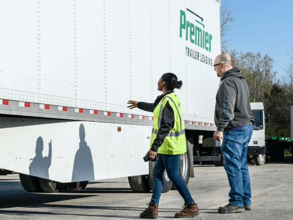 Premier employee giving a customer a tour of inventory